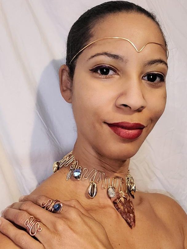 Colorful handmade jewelry with various beads and natural elements intertwined.